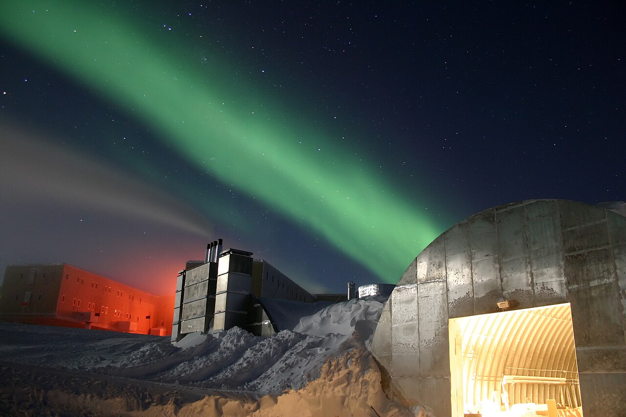 The aurora australis spread over the Amundsen-Scott South Pole Station. It is magnetically symmetric with the aurora borealis.