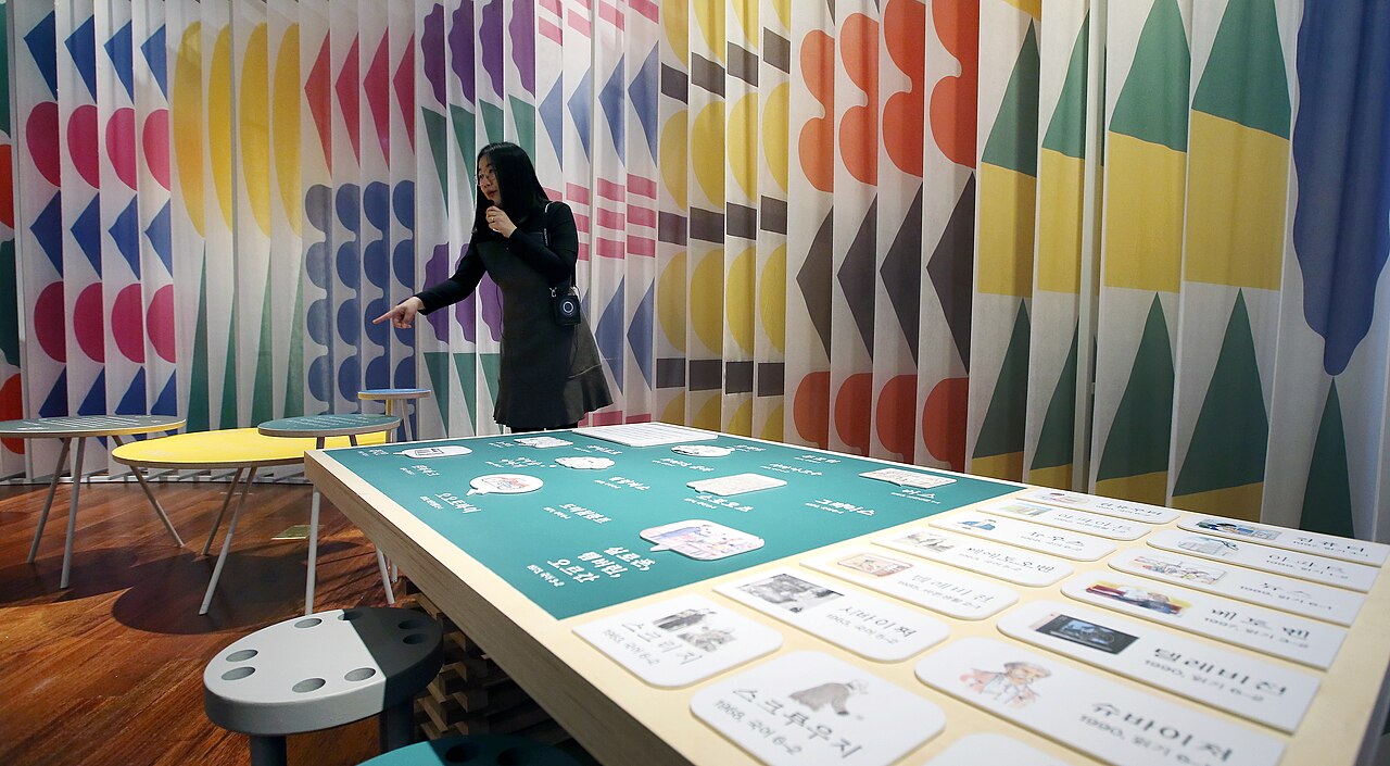 An exhibition space at the National Hangeul Museum. Hangeul — twenty-eight letters at its creation — is written today with twenty-four, after four fell out of use.