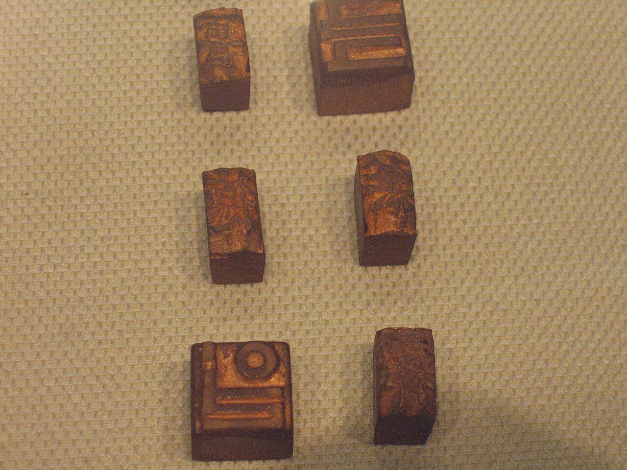 Goryeo metal type on display at the Cheongju Early Printing Museum, each piece made by the beeswax casting used for casting Buddha statues and bells at temples.
