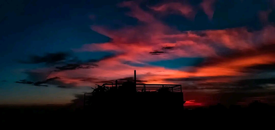 A red sunset as the Sun sinks toward the horizon — the color that remains after blue light has been scattered out along the long atmospheric path.