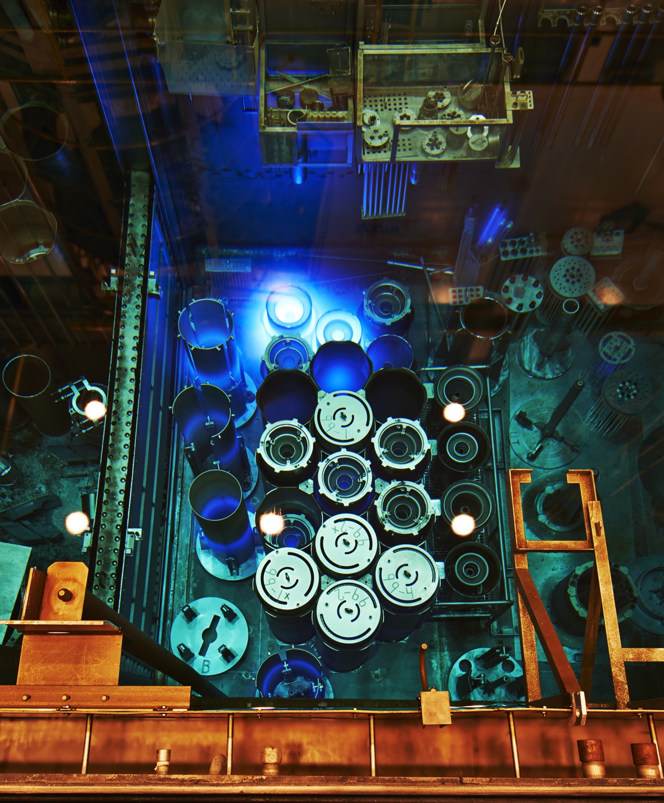 A blue glow surrounding components in a reactor pool
