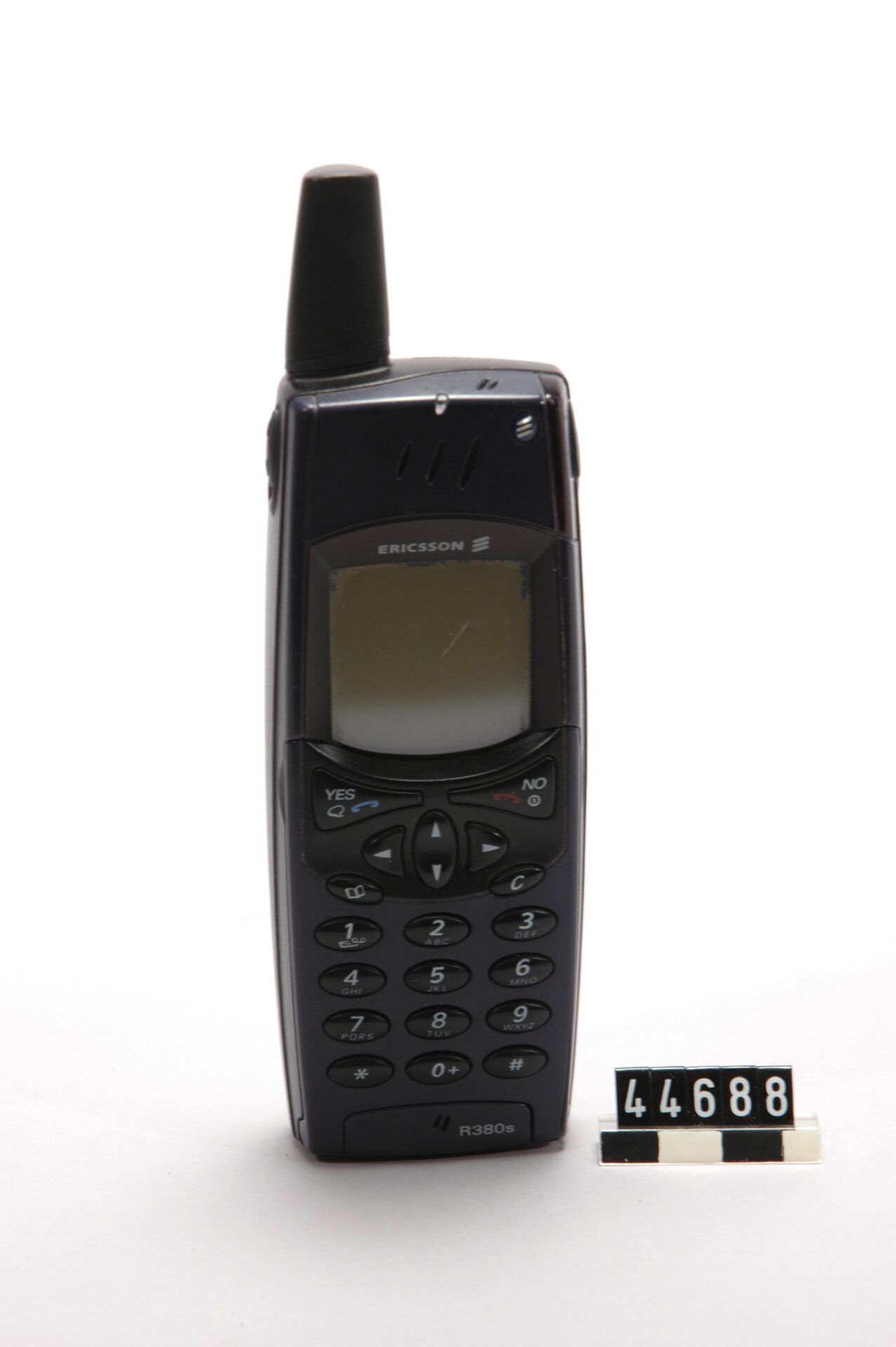 An Ericsson R380-series handset (the unit pictured is an R380s) held by the Swedish National Museum of Science and Technology. It was the first phone line actually sold commercially under the name smartphone.