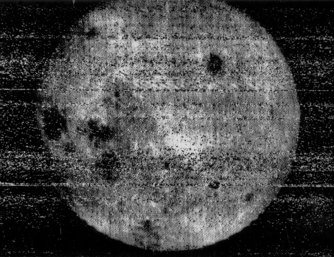 A grainy first photograph of the Moon's far side taken by Luna 3 in 1959