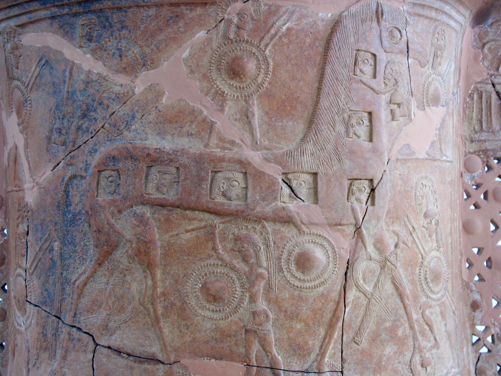 The Trojan Horse and the faces of the armed soldiers hidden inside it, engraved on the Mykonos vase from around 675 BCE