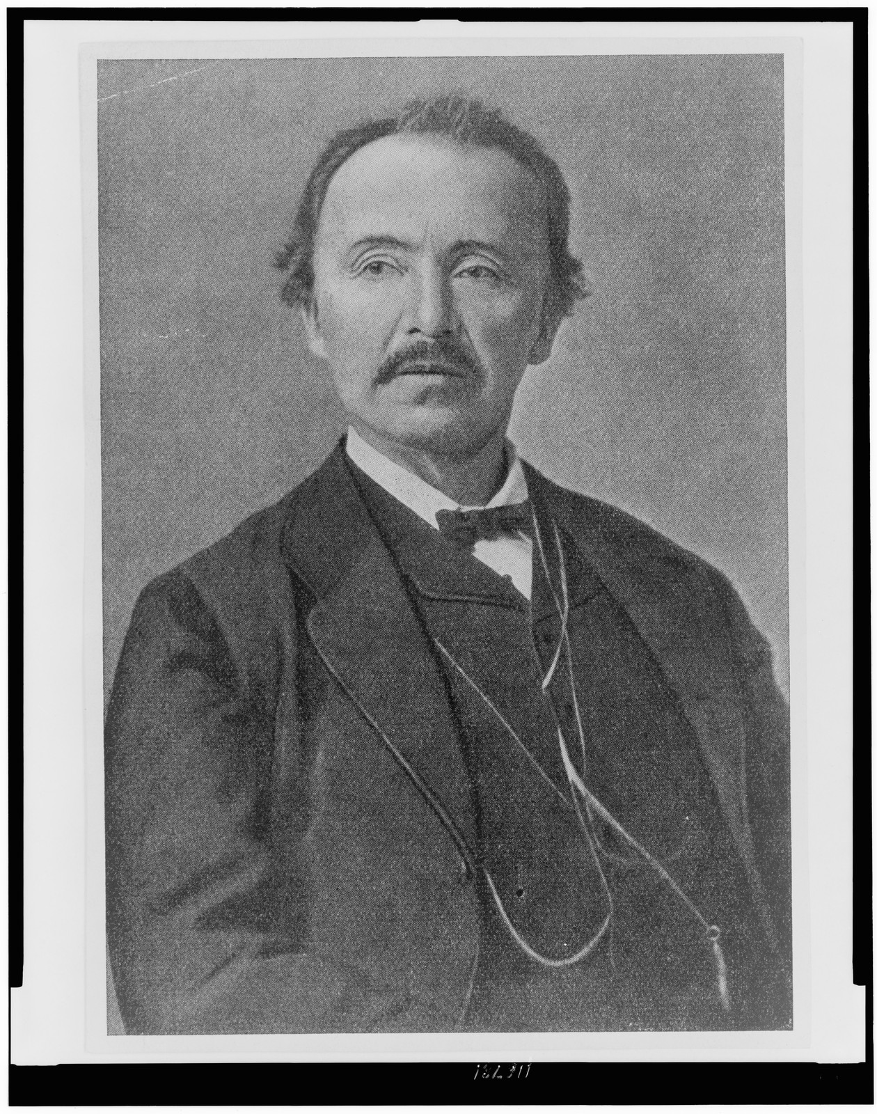 A 19th-century portrait photograph of Heinrich Schliemann