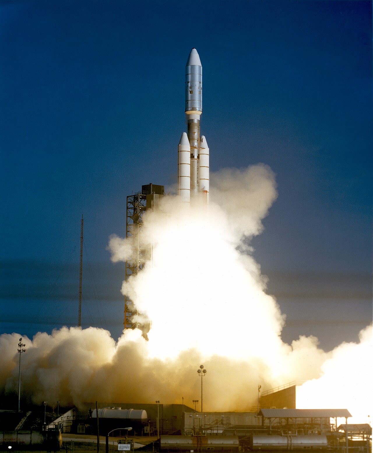 A Titan-Centaur rocket lifting off the launch pad in a blaze of fire