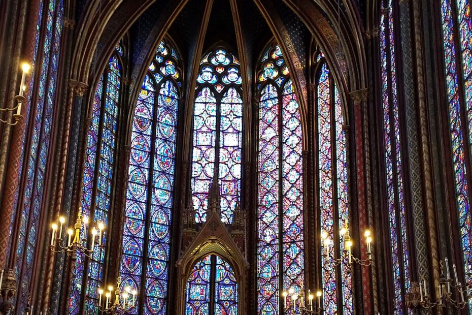 Stained-glass windows inside Sainte-Chapelle. Broad color areas and their dividing lines form a picture at a distance.